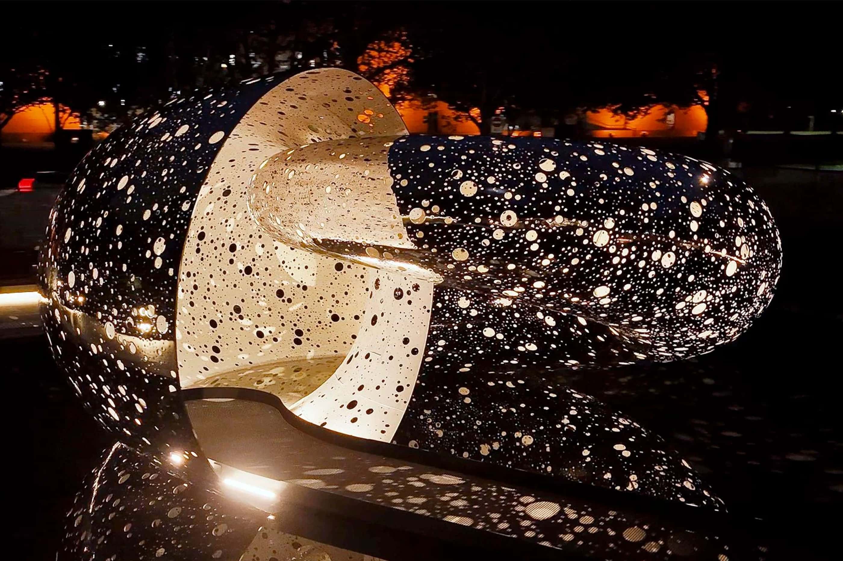 Lindy Lee's Ouroboros illuminated at night, 2024, National Gallery of Australia, Kamberri/Canberra